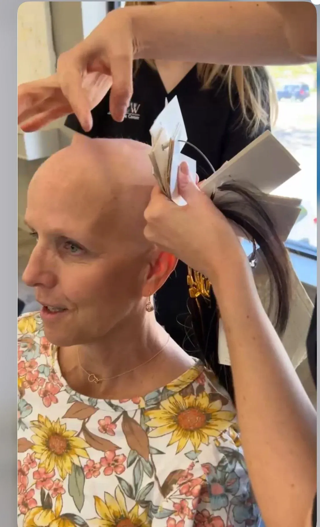 Cancer patient being fitted with wig