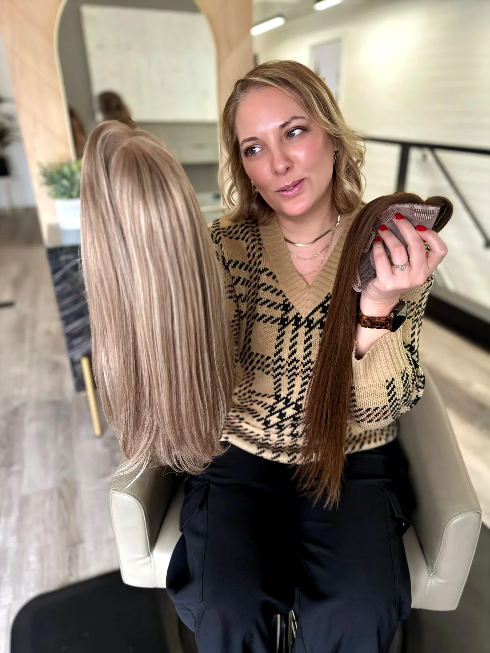 Specialist holding custom wigs